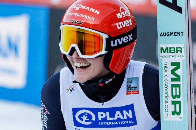 Germany's Selina Freitag reacts after competing in the Women's Individual Large Hill HS140 event of the FIS Ski Jumping World Cup in Klingenthal, eastern Germany on December 13, 2025. (Photo by JENS SCHLUETER / AFP)