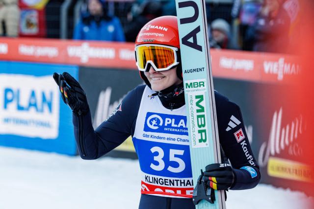Germany's Selina Freitag reacts after competing in the Women's Individual Large Hill HS140 event of the FIS Ski Jumping World Cup in Klingenthal, eastern Germany on December 13, 2025. (Photo by JENS SCHLUETER / AFP)