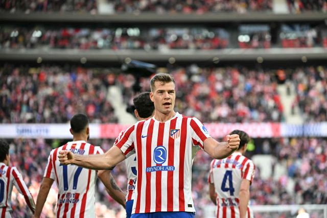 Atletico Madrid's Norwegian forward #09 Alexander Sorloth celebrates scoring a goal that was later annulled during the Spanish league football match between Club Atletico de Madrid and Valencia CF at Metropolitano Stadium in Madrid on December 13, 2025. (Photo by Javier SORIANO / AFP)