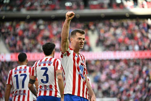 Atletico Madrid's Norwegian forward #09 Alexander Sorloth celebrates scoring a goal that was later annulled during the Spanish league football match between Club Atletico de Madrid and Valencia CF at Metropolitano Stadium in Madrid on December 13, 2025. (Photo by Javier SORIANO / AFP)