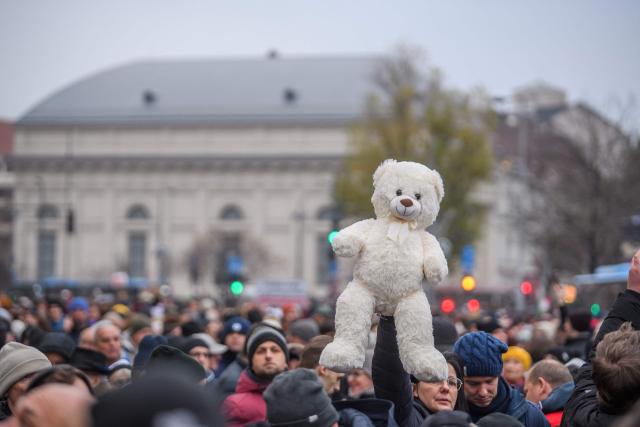 A teddybear is seen as protesters gather for a demonstration where they demand Hungary's Prime Minister's resignation over the government's perceived inaction about widespread abuse in child care institutions in Budapest, Hungary, on December 13, 2025. The demonstration called by with TISZA party opposition's leader after fresh abuse allegations surfaced at a scandal-hit juvenile detention center. (Photo by Ferenc ISZA / AFP)