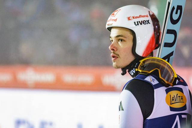 Germany's Raimund Philipp reacts after competing in the Men's Individual Large Hill HS140 event of the FIS Ski Jumping World Cup in Klingenthal, eastern Germany on December 13, 2025. Slovenia's Domen Prevc won the event ahead of Austria's Stefan Kraft (2nd) and Germany's Philipp Raimund (3rd). (Photo by JENS SCHLUETER / AFP)