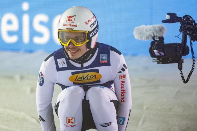 Germany's Raimund Philipp reacts after competing in the Men's Individual Large Hill HS140 event of the FIS Ski Jumping World Cup in Klingenthal, eastern Germany on December 13, 2025. Slovenia's Domen Prevc won the event ahead of Austria's Stefan Kraft (2nd) and Germany's Philipp Raimund (3rd). (Photo by JENS SCHLUETER / AFP)