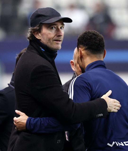 French representative of the Agache family holding company, Antoine Arnault (C) looks on ahead of the French L1 football match between Paris FC and Toulouse FC at the Stade Jean-Bouin in Paris on December 13, 2025. (Photo by FRANCK FIFE / AFP)