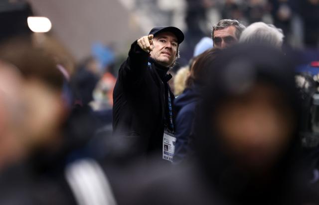 French representative of the Agache family holding company, Antoine Arnault (C) gestures ahead of the French L1 football match between Paris FC and Toulouse FC at the Stade Jean-Bouin in Paris on December 13, 2025. (Photo by FRANCK FIFE / AFP)