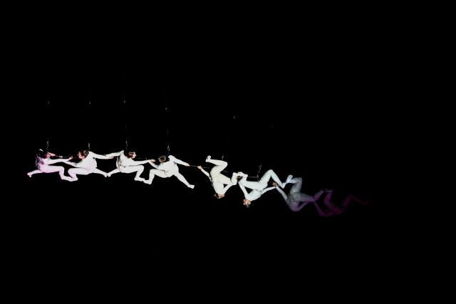 Members of the Zenit dance company perform an aerial ballet titled 'ARIA' above spectators in the old port of Marseille, southern France, during the city’s Christmas celebrations, on December 13, 2025. (Photo by Thibaud MORITZ / AFP)