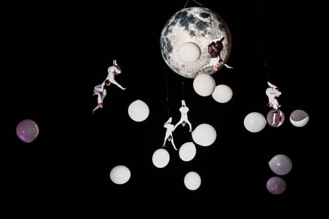 Members of the Zenit dance company perform an aerial ballet titled 'ARIA' above spectators in the old port of Marseille, southern France, during the city’s Christmas celebrations, on December 13, 2025. (Photo by Thibaud MORITZ / AFP)
