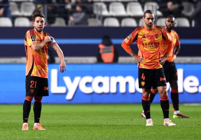 Paris FC's French midfielder #21 Maxime Lopez (L) and Paris FC's French midfielder #04 Vincent Marchetti react after a second goal of Toulouse during the French L1 football match between Paris FC and Toulouse FC at the Stade Jean-Bouin in Paris on December 13, 2025. (Photo by FRANCK FIFE / AFP)