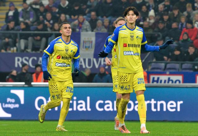 STVV's Japanese forward #42 Keisuke Goto celebrates after scoring during the Belgian Pro League football match between RSC Anderlecht and Sint-Truidense V.V.  in Brussels on December 13, 2025. (Photo by JILL DELSAUX / Belga / AFP) / Belgium OUT