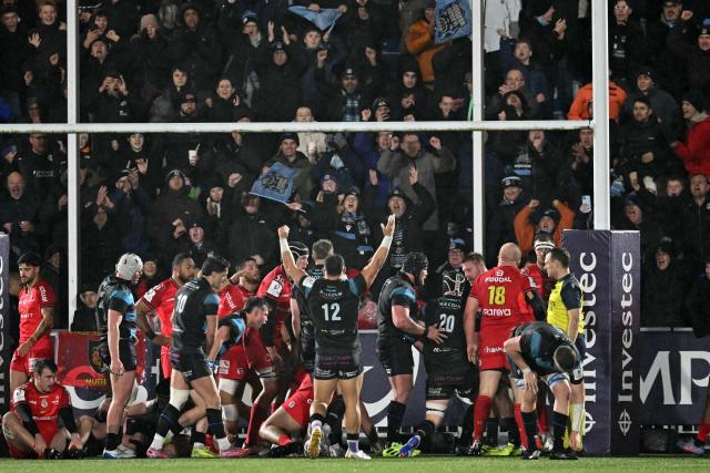 Glasgow score a second try during the European Champions Cup rugby union pool 1 match between Glasgow Warriors and Toulouse at Scotstoun Stadium in Glasgow, Scotland on December 13, 2025. (Photo by ANDY BUCHANAN / AFP)
