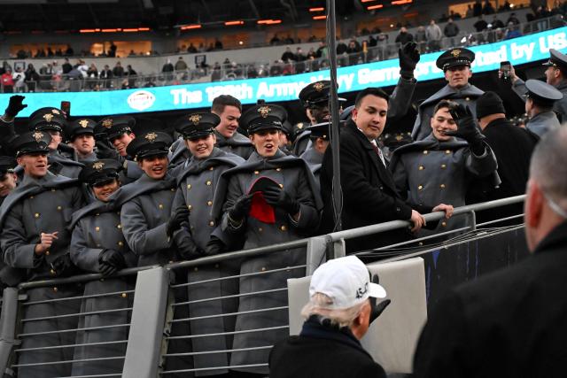 US President Donald Trump greets US Army soldiers at the college football game between the Army and Navy at the M&T Bank Stadium in Baltimore, Maryland, on December 13, 2025. (Photo by Alex WROBLEWSKI / AFP)