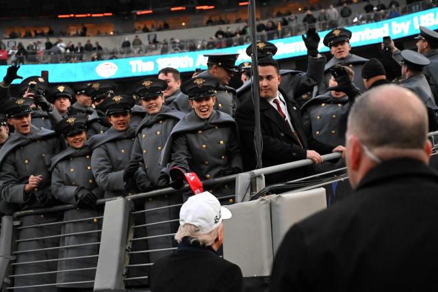 US President Donald Trump greets US Army soldiers at the college football game between the Army and Navy at the M&T Bank Stadium in Baltimore, Maryland, on December 13, 2025. (Photo by Alex WROBLEWSKI / AFP)
