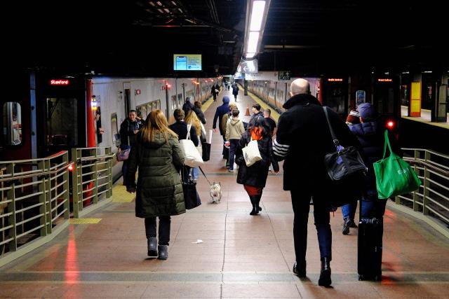 People shop in a liquor store in the Manhattan borough of New York City on December 13, 2025. (Photo by CHARLY TRIBALLEAU / AFP)