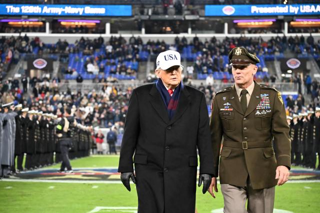 US President Donald Trump walks with Lt Gen Steven Gilland, Superintendent of the U.S. Military Academy at West Point, at the college football game between the US Army and Navy at the M&T Bank Stadium in Baltimore, Maryland, on December 13, 2025. (Photo by Alex WROBLEWSKI / AFP)