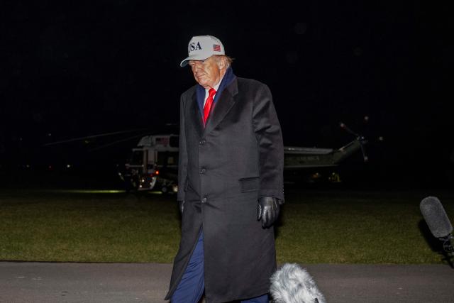 US President Donald Trump walks to the White House residence after speaking to the press on the South Lawn of the White House in Washington, DC, on December 13, 2025 upon his return from attending the US Army vs. US Navy football game in Baltimore, Maryland. (Photo by DANIEL HEUER / AFP)