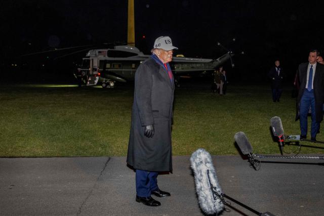 US President Donald Trump speaks to the press after disembarking from Marine One on the South Lawn of the White House in Washington, DC, on December 13, 2025 after attending he US Army vs. US Navy football game in Baltimore, Maryland. (Photo by DANIEL HEUER / AFP)