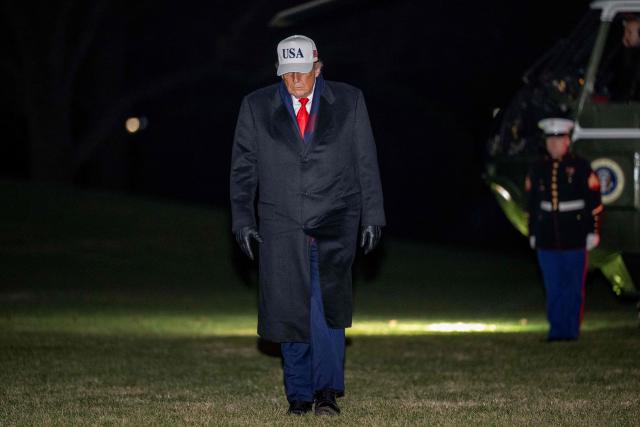 US President Donald Trump walks from Marine One to the White House in Washington, DC, on December 13, 2025 after attending he US Army vs. US Navy football game in Baltimore, Maryland. (Photo by DANIEL HEUER / AFP)