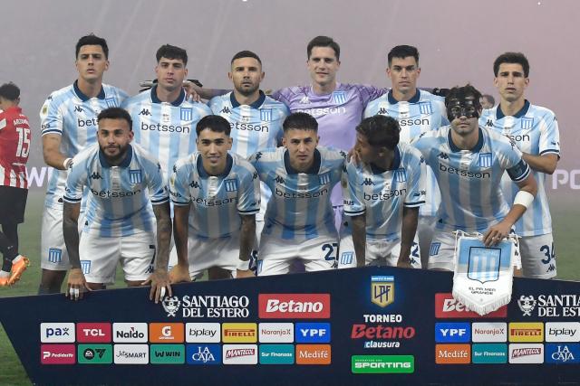 Racing's players pose for a team photo ahead of the Argentine Professional Football League 2025 Clausura Tournament final match between Racing and Estudiantes at the Madre de Ciudades stadium in Santiago del Estero, Argentina on December 13, 2025. (Photo by Luis SANTILLAN / AFP)