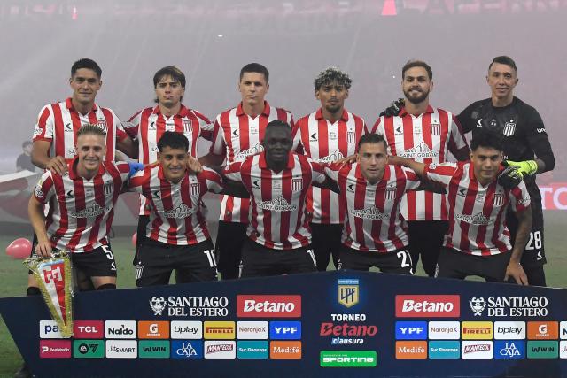 Estudiantes' players pose for a team photo ahead of the Argentine Professional Football League 2025 Clausura Tournament final match between Racing and Estudiantes at the Madre de Ciudades stadium in Santiago del Estero, Argentina on December 13, 2025. (Photo by Luis SANTILLAN / AFP)