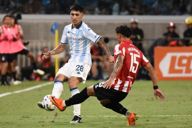 Racing's forward #28 Santiago Solari and Estudiantes's defender #15 Santiago Arzamendia fight for the ball during the Argentine Professional Football League 2025 Clausura Tournament final match between Racing and Estudiantes at the Madre de Ciudades stadium in Santiago del Estero, Argentina on December 13, 2025. (Photo by Luis Santillan / AFP)