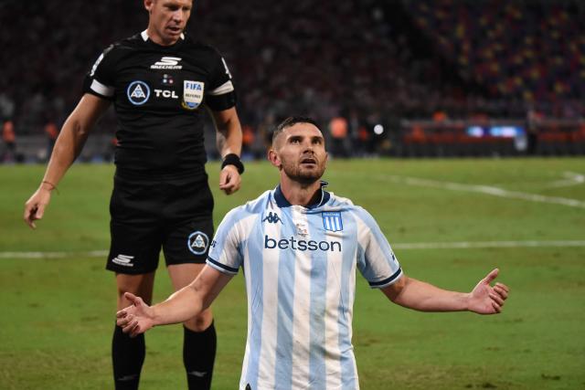 Racing's forward #09 Adrian Martinez celebrates scoring his team's first goal during the Argentine Professional Football League 2025 Clausura Tournament final match between Racing and Estudiantes at the Madre de Ciudades stadium in Santiago del Estero, Argentina on December 13, 2025. (Photo by Luis Santillan / AFP)
