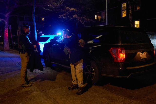 FBI agents arrive to the Barus & Holley engineering building at Brown University campus in Providence, Rhode Island, on December 13, 2025. A gunman killed two people and critically wounded eight others in the afternoon of December 13 at prestigious Brown University, authorities said, urging people in the area to remain in lockdown as the attacker was still at large. (Photo by Bing Guan / AFP)