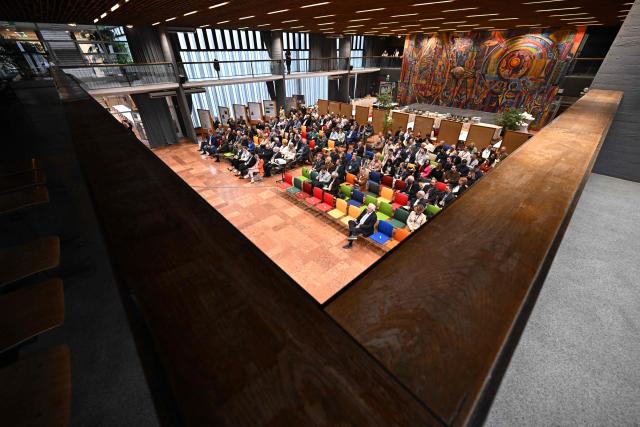 Participants listen to a presentation at the Budai Campus of the Hungarian University of Agriculture and Life Sciences (MATE) in Budapest, Hungary, on November 13, 2025, during the the 7th National Viticulture and Winemaking conference. An outbreak of the flavescence doree disease has ravaged Europe's wine regions, including in Hungary. Flavescence doree (FD) is "one of the most dangerous diseases" threatening vineyards today, according to the International Organisation of Vine and Wine (OIV). Infection -- usually indicated by discoloured leaves -- greatly reduces vine productivity, and there is no known cure, although it is not harmful to humans. FD is transmitted primarily by the American grapevine leafhopper, a pest that has spread significantly across central Europe in recent years. (Photo by Attila KISBENEDEK / AFP)