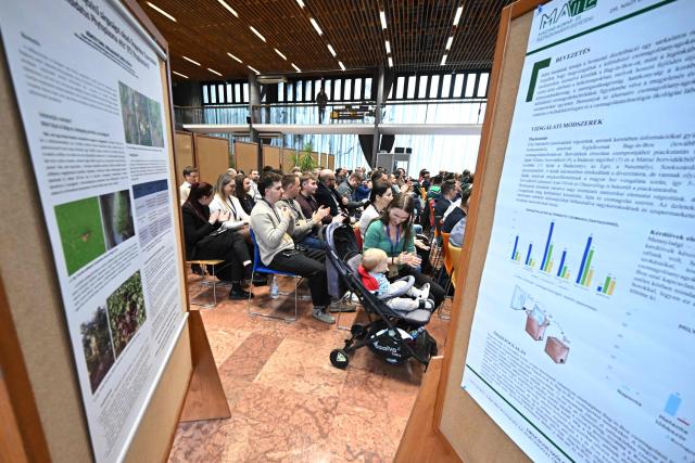 Participants listen to a presentation at the Budai Campus of the Hungarian University of Agriculture and Life Sciences (MATE) in Budapest, Hungary, on November 13, 2025, during the the 7th National Viticulture and Winemaking conference. An outbreak of the flavescence doree disease has ravaged Europe's wine regions, including in Hungary. Flavescence doree (FD) is "one of the most dangerous diseases" threatening vineyards today, according to the International Organisation of Vine and Wine (OIV). Infection -- usually indicated by discoloured leaves -- greatly reduces vine productivity, and there is no known cure, although it is not harmful to humans. FD is transmitted primarily by the American grapevine leafhopper, a pest that has spread significantly across central Europe in recent years. (Photo by Attila KISBENEDEK / AFP)