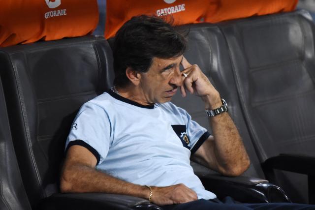Racing's head coach Gustavo Costas reacts after losing the penalty shootout of the Argentine Professional Football League 2025 Clausura Tournament final match between Racing and Estudiantes at the Madre de Ciudades stadium in Santiago del Estero, Argentina on December 13, 2025. (Photo by Luis Santillan / AFP)