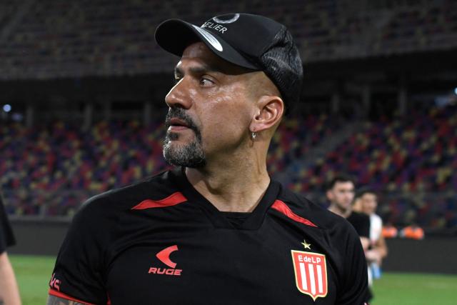 Estudiantes' Argentine president and former player Juan Sebastian Veron looks on at the pitch after winning the Argentine Professional Football League 2025 Clausura Tournament final match between Racing and Estudiantes at the Madre de Ciudades stadium in Santiago del Estero, Argentina on December 13, 2025. (Photo by Luis Santillan / AFP)