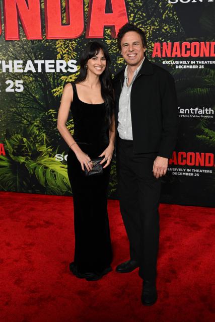 US director Tom Gormican (R) and Australian actress Renee Herbert attend the premiere of Columbia Pictures' "Anaconda" at The United Theater on Broadway in Los Angeles, California, on December 13, 2025. (Photo by Robyn Beck / AFP)