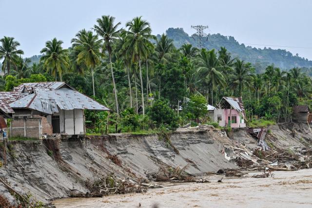 A general view shows a flood-affected area in Juli, in Indonesia's Aceh province on December 14, 2025. Devastating floods and landslides have killed 1,006 people in Indonesia, rescuers said December 13 as the Southeast Asian nation grapples with the huge scale of relief efforts. (Photo by CHAIDEER MAHYUDDIN / AFP)