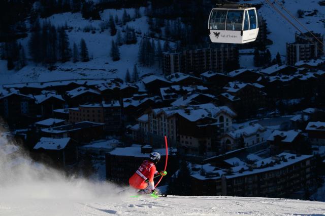 Switzerland's Marc Rochat competes during the first run of the Men's Slalom event of the FIS Alpine Skiing World Cup in Val d'Isere, on December 14, 2025. (Photo by Olivier CHASSIGNOLE / AFP)