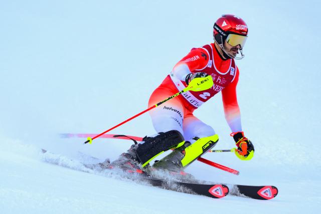 Switzerland's Loic Meillard competes during the first run of the Men's Slalom event of the FIS Alpine Skiing World Cup in Val d'Isere, on December 14, 2025. (Photo by Olivier CHASSIGNOLE / AFP)