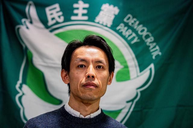 Lo Kin-hei, chairman of Hong Kong's Democratic Party (DP), attends a press conference at the party's headquarters in Hong Kong on December 14, 2025. Hong Kong's oldest pro-democracy party has formally decided to disband, its leader announced on December 14, following its annual meeting. (Photo by Leung Man Hei / AFP)