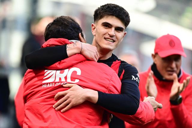 AC Milan's Italian defender #33 Davide Bartesaghi celebrates after scoring his team first goal during the Italian Serie A football match between AC Milan and Sassuolo at the San Siro Stadium in Milan, Italy on December 14, 2025. (Photo by Piero CRUCIATTI / AFP)