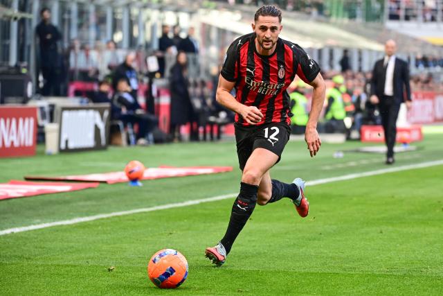 AC Milan's French midfielder #12 Adrien Rabiot runs for the ball during the Italian Serie A football match between AC Milan and Sassuolo at the San Siro Stadium in Milan, Italy on December 14, 2025 (Photo by Piero CRUCIATTI / AFP)