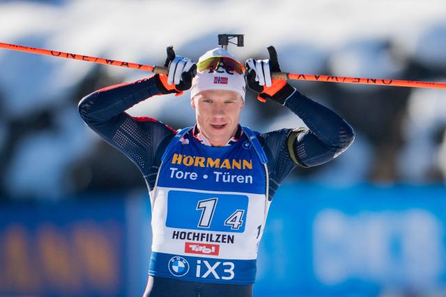 Norway's Vetle Sjastad Christiansen reacts as he crosses the finish line of the men's 4x7,5km relay event of the IBU Biathlon World Cup in Hochfilzen, Austria on December 14, 2025. (Photo by GEORG HOCHMUTH / APA / AFP) / Austria OUT
