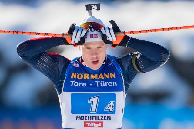 Norway's Vetle Sjastad Christiansen reacts as he crosses the finish line of the men's 4x7,5km relay event of the IBU Biathlon World Cup in Hochfilzen, Austria on December 14, 2025. (Photo by GEORG HOCHMUTH / APA / AFP) / Austria OUT