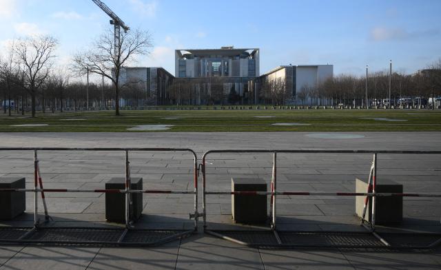 The chancellery is sealed off ahead a meeting of the Ukrainian President with European leaders as well as US President Donald Trump's envoy, the heads of the EU and NATO for talks on December 14, 2025 in Berlin. (Photo by RALF HIRSCHBERGER / AFP)