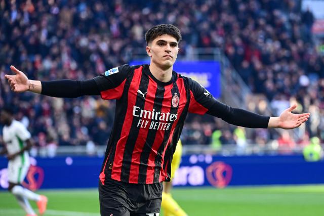 AC Milan's Italian defender #33 Davide Bartesaghi celebrates after scoring his team second goal during the Italian Serie A football match between AC Milan and Sassuolo at the San Siro Stadium in Milan, Italy on December 14, 2025 (Photo by Piero CRUCIATTI / AFP)