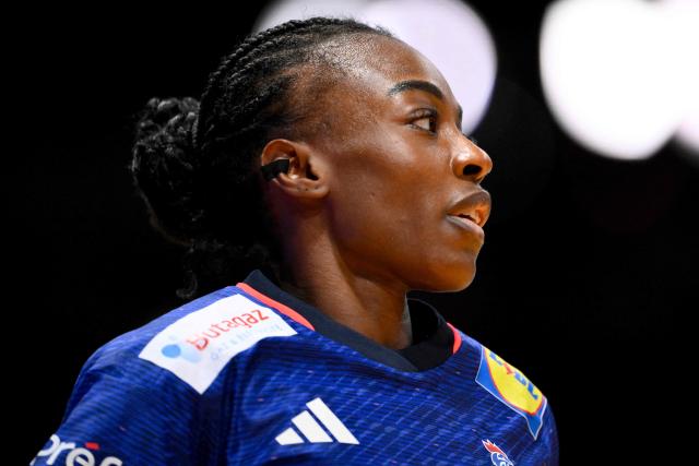 France's pivot #29 Onacia Ondono looks on ahead of the IHF Women's Handball World Championship match for 3rd place between the Netherlands and France at the Rotterdam Ahoy Arena, in Rotterdam on December 14, 2025. (Photo by JOHN THYS / AFP)