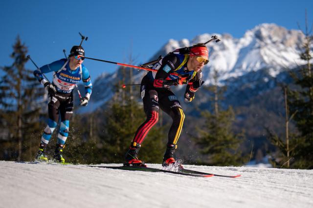 Estonia's Rene Zahkna and Germany's David Zobel compete during the men's 4x7,5km relay event of the IBU Biathlon World Cup in Hochfilzen, Austria on December 14, 2025. (Photo by GEORG HOCHMUTH / APA / AFP) / Austria OUT
