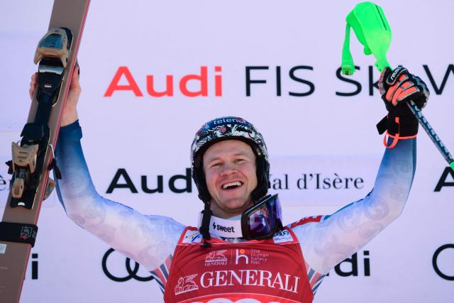 Norway's Timon Haugan celebrates his victory on the podium after winning the second run of the Men's Slalom event of the FIS Alpine Skiing World Cup in Val d'Isere, on December 14, 2025. (Photo by Olivier CHASSIGNOLE / AFP)