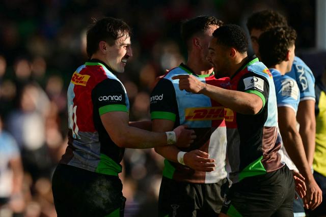 Harlequins' English wing Cadan Murley (L) celebrates after scoring the first try during the European Rugby Champions Cup fourth round, pool 3, rugby union match between Harlequins and Bayonne at Twickenham Stoop Stadium in west London on December 14, 2025. (Photo by Ben STANSALL / AFP)