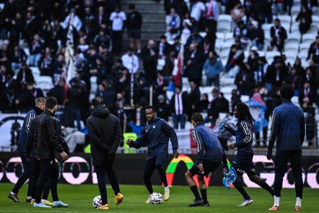 Le Havre players warm up ahead of the French L1 football match between Olympique Lyonnais (OL) and Le Havre AC at the Groupama Stadium in Decines-Charpieu, central-eastern France, on December 14, 2025. (Photo by JEFF PACHOUD / AFP)