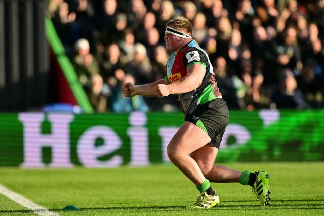 Harlequins' English prop Fin Baxter reacts after scoring their third try during the European Rugby Champions Cup fourth round, pool 3, rugby union match between Harlequins and Bayonne at Twickenham Stoop Stadium in west London on December 14, 2025. (Photo by Ben STANSALL / AFP)