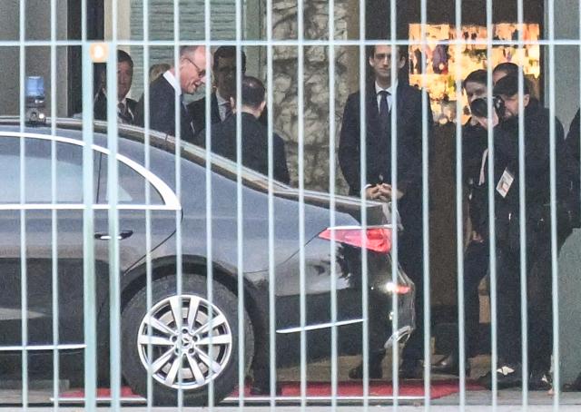 German Chancellor Friedrich Merz (R) greets Ukraine's President Volodymyr Zelensky prior to a meeting at the Chancellery in Berlin, on December 14, 2025. Ukrainian President Volodymyr Zelensky traveled to Berlin to meet European leaders as well as the heads of the EU and NATO, German government spokesman Stefan Kornelius said. (Photo by RALF HIRSCHBERGER / AFP)
