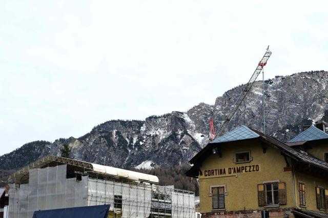 A picture shows renovation works around the railway station of Cortina d'Ampezzo ahead of the Milano Cortina 2026 Olympic Games, on December 11, 2025. (Photo by Stefano RELLANDINI / AFP)