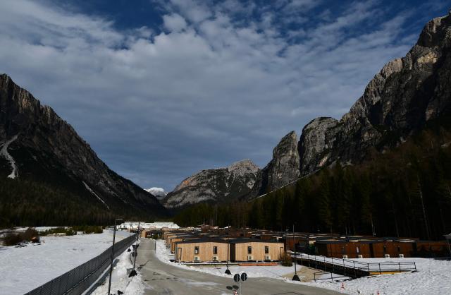 A picture shows a part of the Cortina Athletes Village built by Simico, the company in charge of the infrastructure works for the temporary complex of modular mobile homes ahead of Milano Cortina 2026 Olympic Games, in Fiames, near Cortina d'Ampezzo, on December 11, 2025. (Photo by Stefano RELLANDINI / AFP)